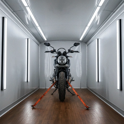 Professional motorcycle secured inside an enclosed transport trailer